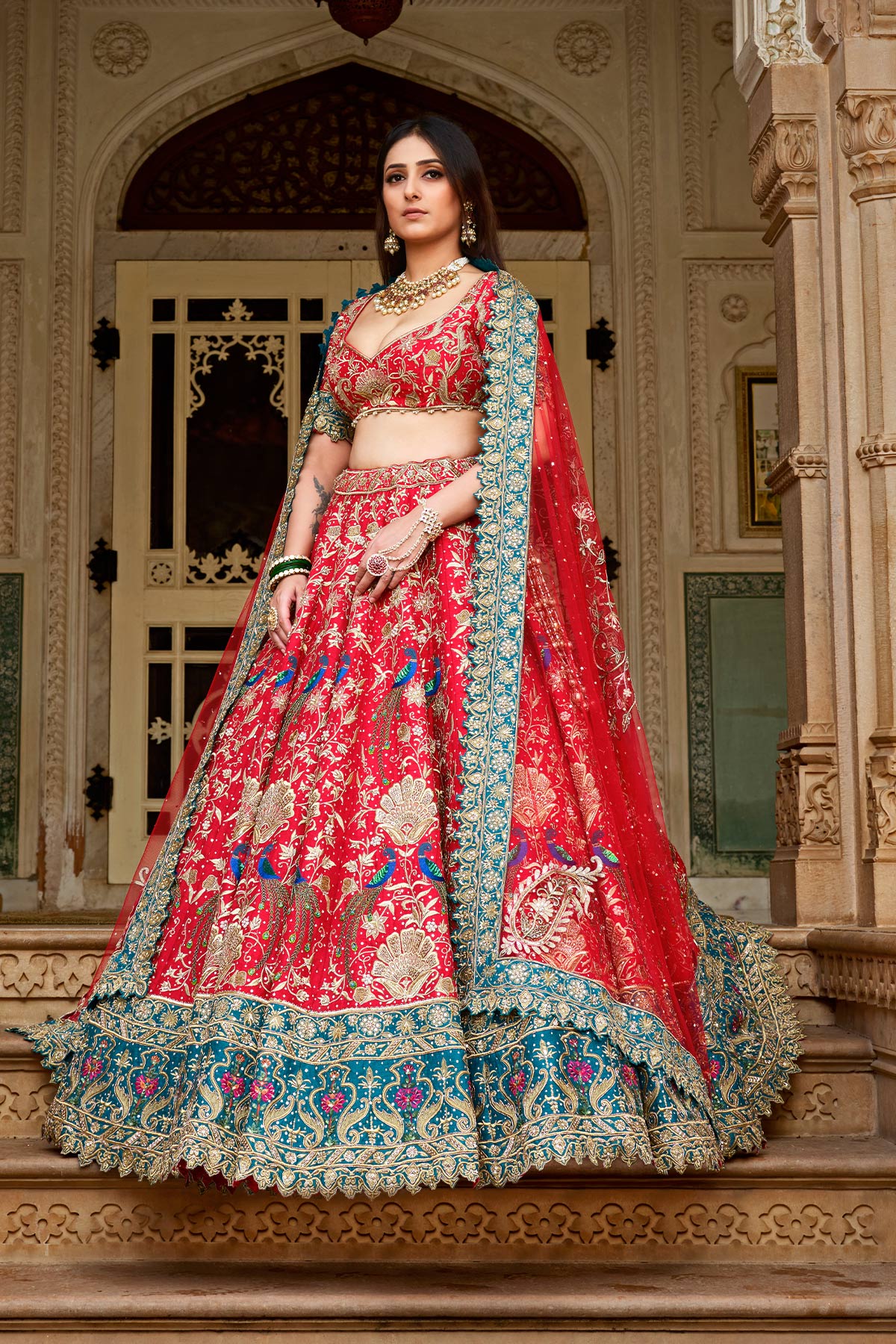 A Classic Red And Teal Green Lehenga