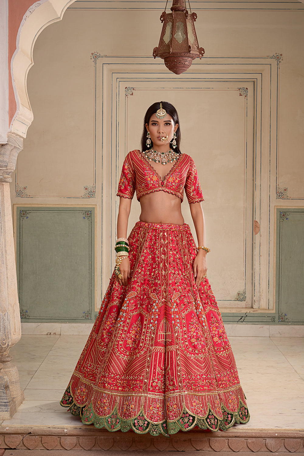 A Red Silk Lehenga, Featuring Peacocks And Floral Motifs