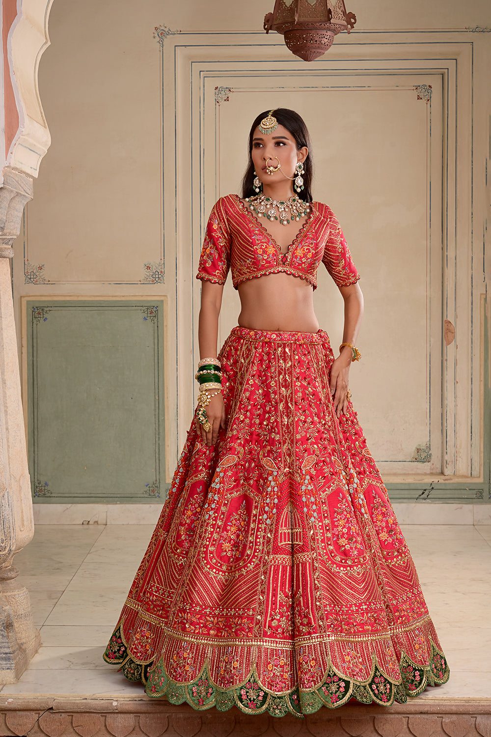 A Red Silk Lehenga, Featuring Peacocks And Floral Motifs